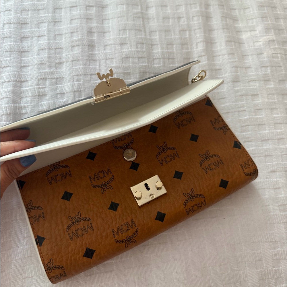 MCM Tan and White Clutch
